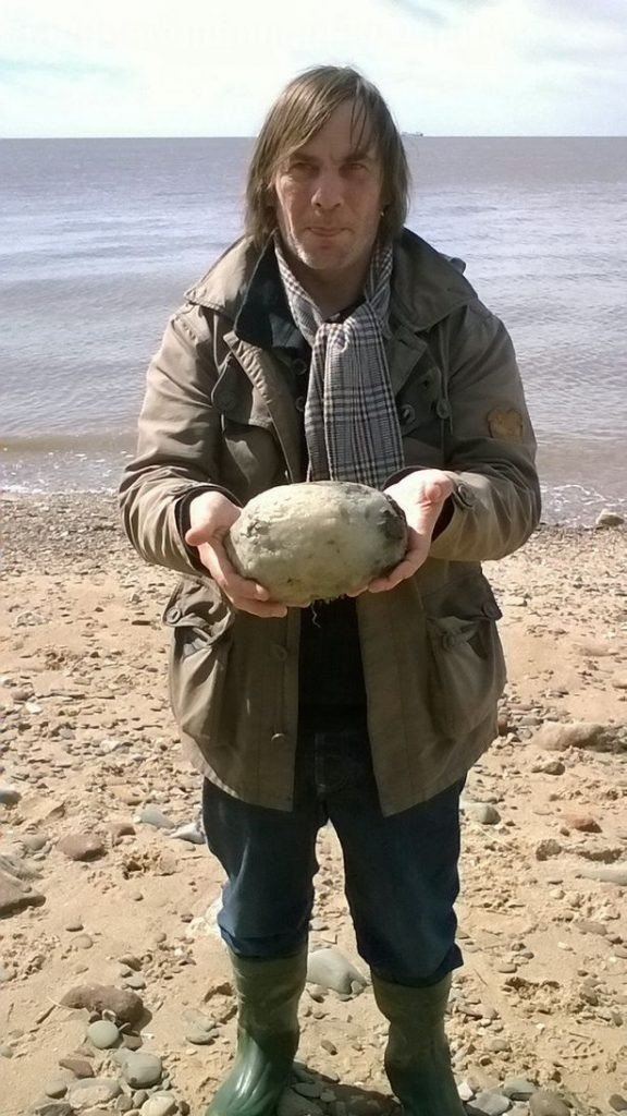 Were strolling along the shore when they came across what some believed to be a typical stone.