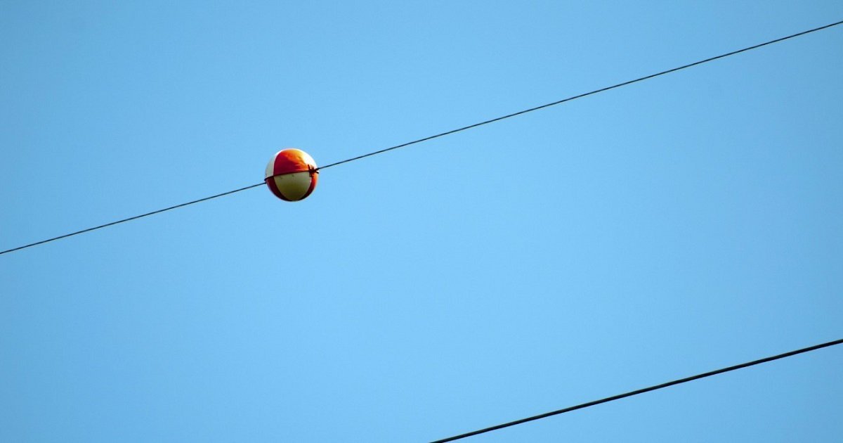 The Reasons Behind the Vibrant Balls on Power Lines